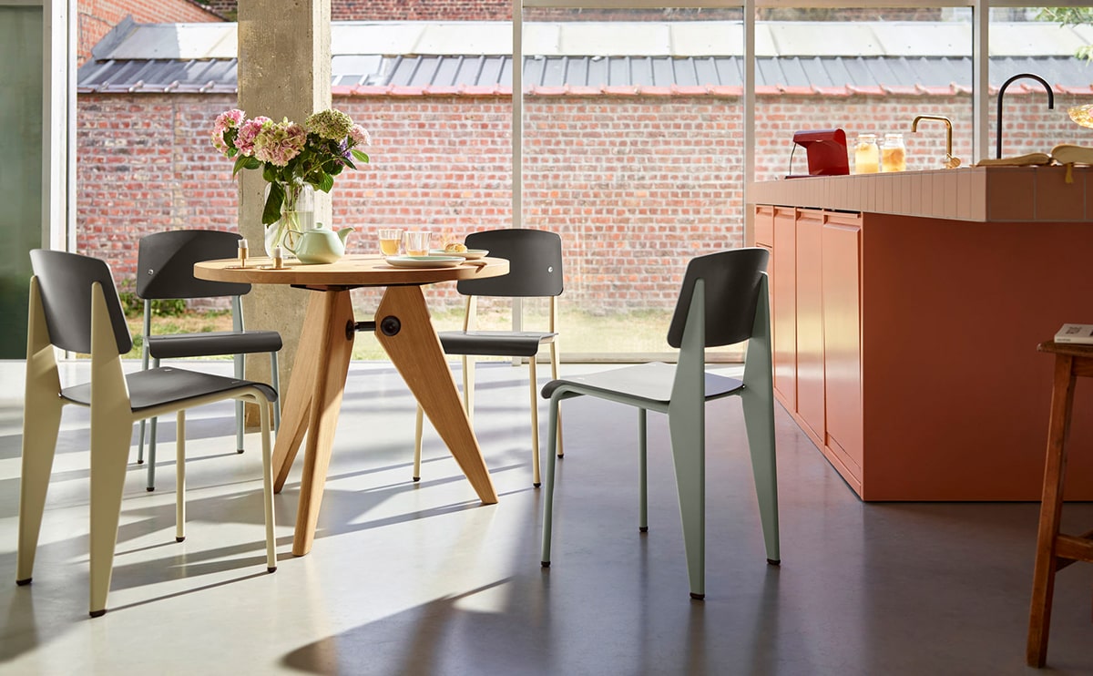 Modern dining area with natural light and Gorvey lighting fixtures.