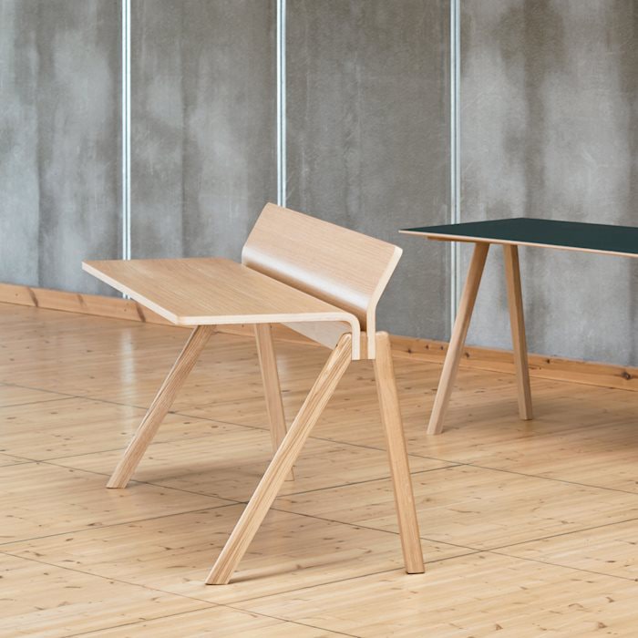 Modern wooden chair and table in minimalist interior design.