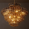 Elegant Gorvey lighting fixture with intricate design and warm illumination.