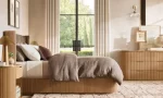 Modern bedroom with Gorvey lighting and stylish decor.