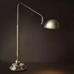 Modern Gorvey table lamp with adjustable arm and metallic finish.