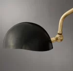 Modern black and brass task table lamp for home or office lighting.