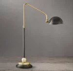 Modern task table lamp with black, gold, and marble accents for stylish lighting.