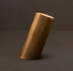 Elegant gold cylindrical lamp from Gorvey Lighting for modern interiors.