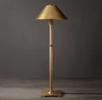 Elegant gold table lamp with a metal shade and adjustable stand.