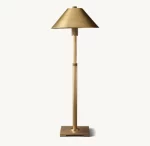 Elegant gold metal shade table lamp for modern decor.