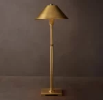 Elegant gold table lamp with metal shade for modern decor.
