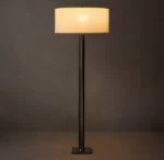 Modern floor lamp with a black stand and beige lampshade.