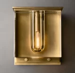Modern gold wall sconce with cylindrical light element for elegant lighting.