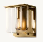 Modern gold and glass wall sconce with exposed filament bulbs.