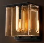Gorvey lighting fixture with glass and Edison bulbs in a modern design.