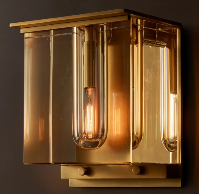Gorvey lighting fixture with a modern gold finish and glass elements.