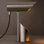 Modern Gorvey spotlight with adjustable arm and sleek design.