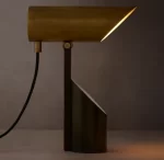 Modern Champeaux folding spotlight by Gorvey with sleek design and adjustable lighting.