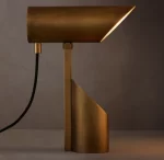 Elegant modern desk lamp with brass finish and adjustable LED light.
