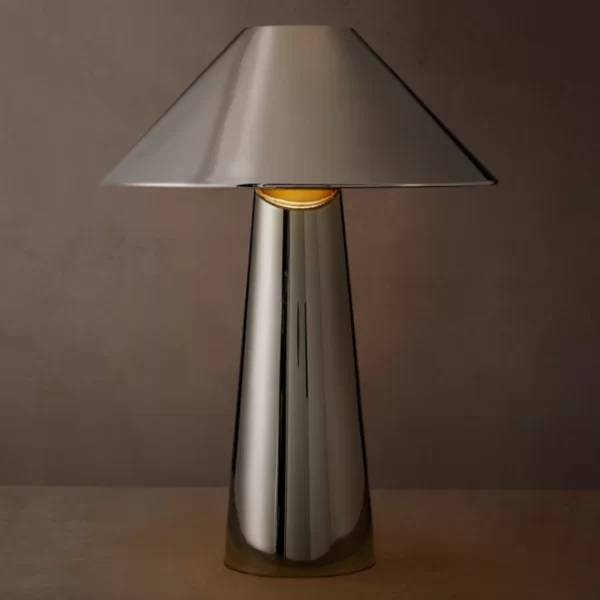 Sleek metallic table lamp with a conical shade and cylindrical base.