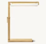 Modern task table lamp with a sleek gold finish and adjustable arm.