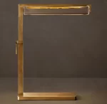 Elegant gold desk lamp with modern design for task lighting.