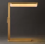 Modern gold task table lamp with LED light for workspace or reading.