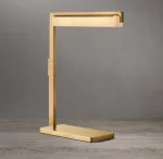 Modern gold task table lamp with sleek design for home or office.