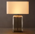 Gorvey Lighting GV Lacour clear glass table lamp with beige shade.