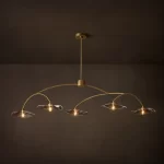 Gorvey Lily Smoke Glass Linear Chandelier with five glass shades and gold finish.