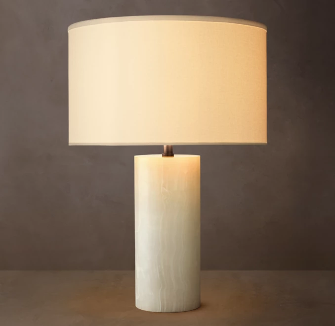 Gorvey Stone Cylindrical Table Lamp with warm light for modern decor.