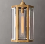 Elegant pendant light with glass panels and brass finish for modern interiors.