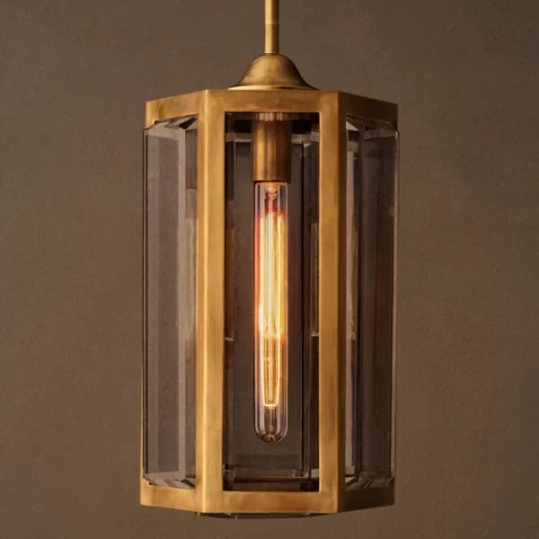 Modern pendant light with brass frame and glass panels for elegant decor.