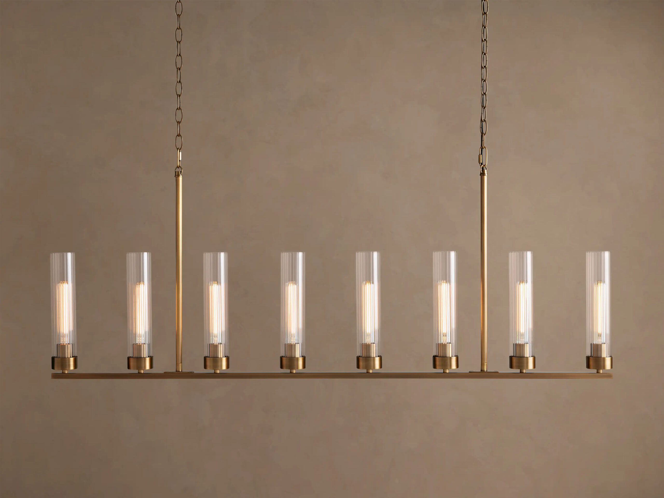 6610031H609_CA260122 GV Andreas brass linear light 8 Light Chandelier - Image 1