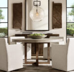 Elegant dining room with Gorvey lighting fixture and stylish decor.