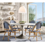 Elegant dining room with Gorvey lighting and stylish chairs.