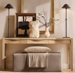 Elegant living room decor with modern black lamps and decorative items.