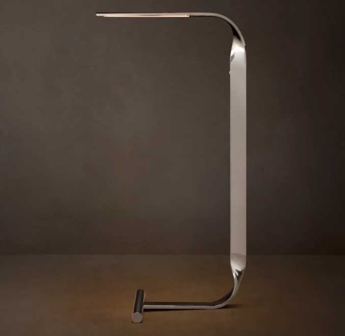 Modern LED desk lamp with sleek metallic design for stylish lighting.