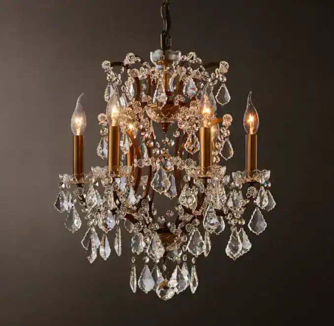 Elegant crystal chandelier with gold accents and candle-style lights for luxurious lighting.