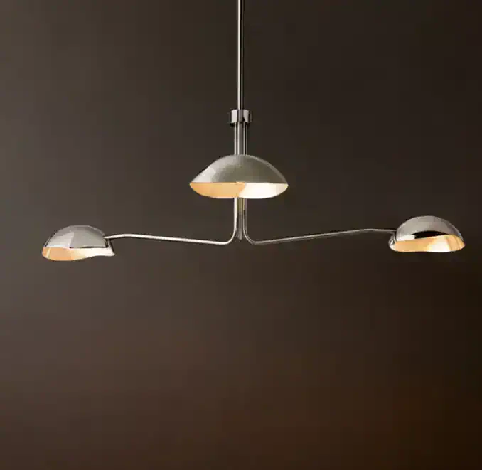 Modern chandelier with three adjustable lampshades for stylish lighting.