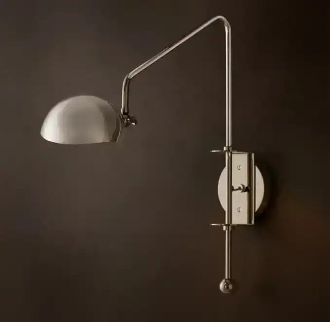 Contemporary wall-mounted lamp with adjustable arm and metallic finish.