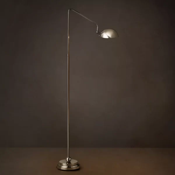 Sleek silver floor lamp with adjustable arm and dome shade for modern interiors.