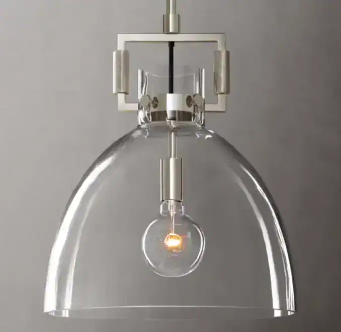 Modern pendant lamp with clear glass shade and LED bulb for stylish lighting.