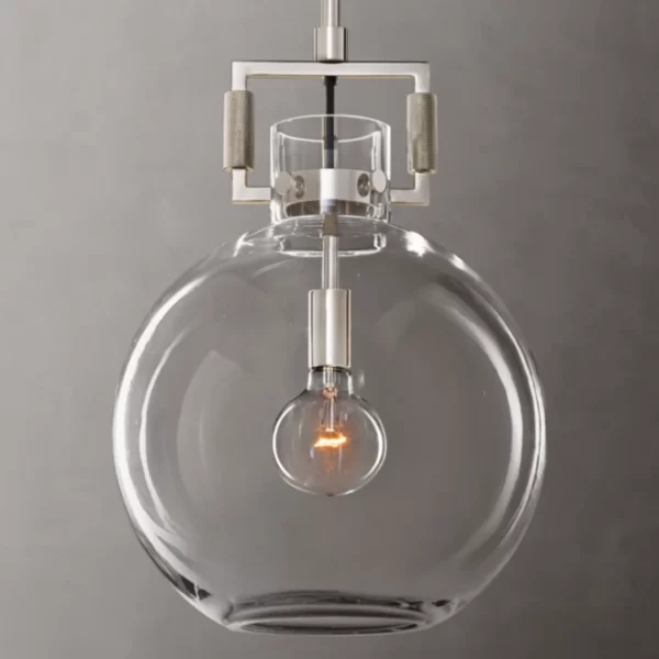 Elegant glass pendant lamp with visible filament bulb for modern lighting design.