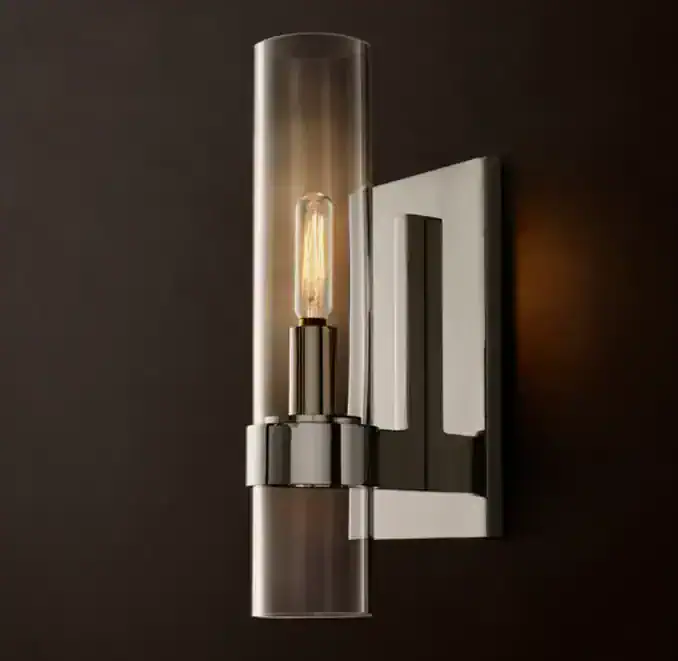 Modern wall sconce with glass tube and Edison bulb for stylish lighting.