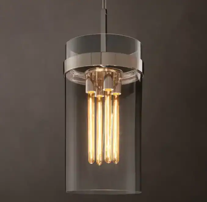 Modern pendant light with clear glass and warm Edison bulbs for stylish illumination.