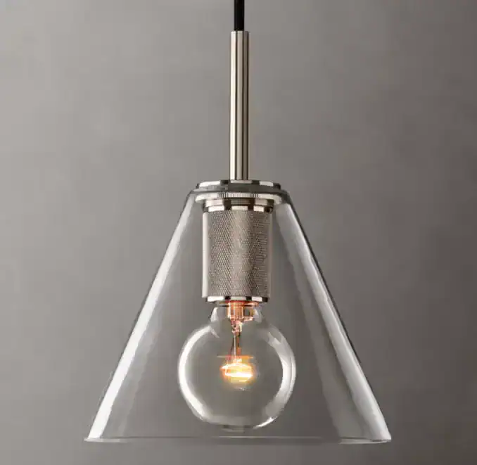 Contemporary pendant light with clear glass shade and Edison bulb.