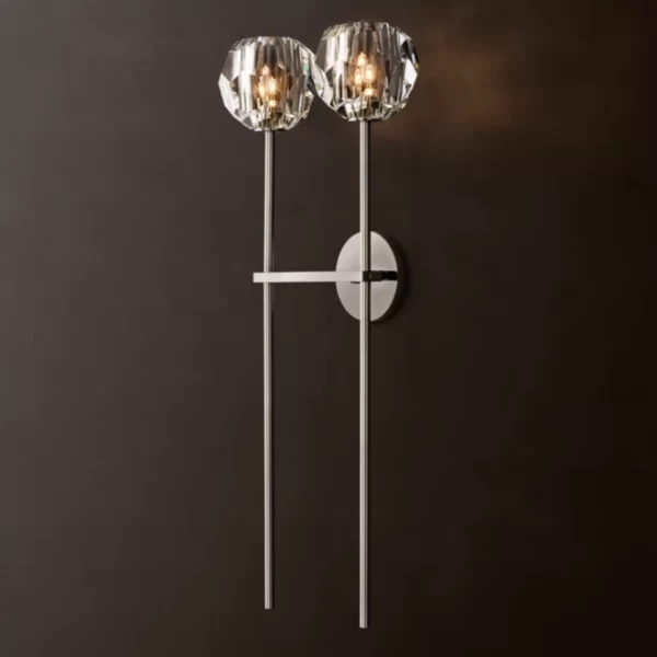 Elegant modern wall sconce with crystal accents and sleek metal design.