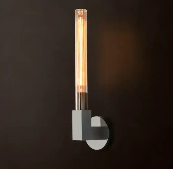 Contemporary wall lamp with a sleek design and warm lighting for modern interiors.