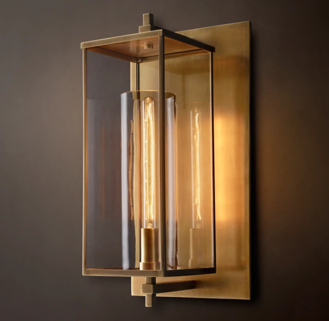 Elegant modern wall lamp with glass and gold accents for stylish lighting.
