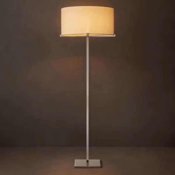 Elegant floor lamp with a beige lampshade and sleek metal stand.