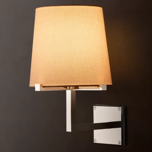 Modern wall lamp with beige lampshade and white mounting bracket.