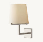 Modern wall lamp with beige fabric shade and metal mount.