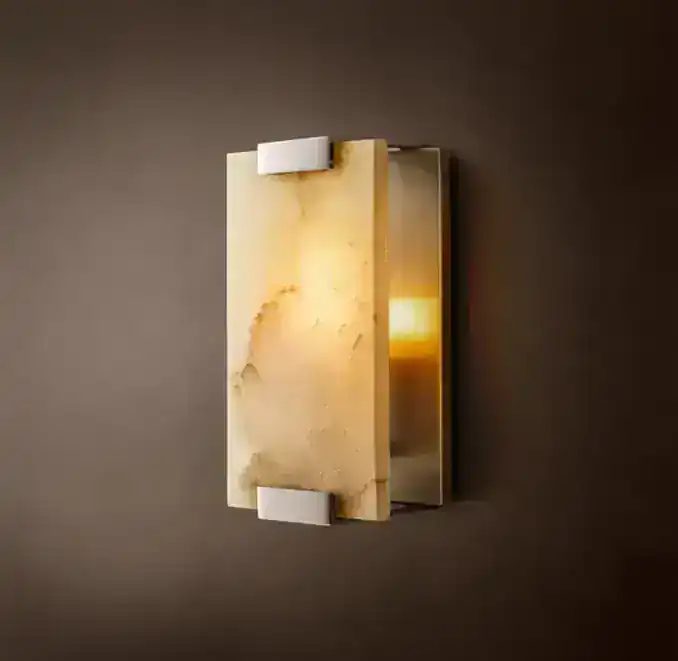 Elegant modern wall sconce with warm lighting and sleek design for stylish interiors.